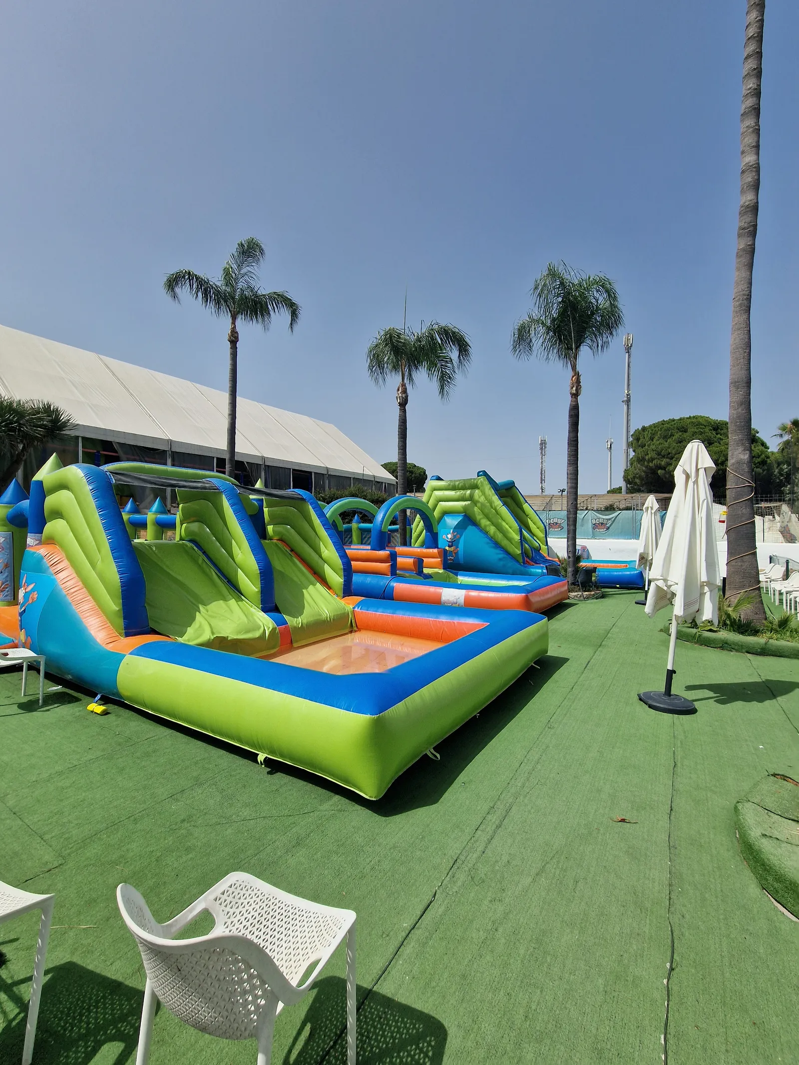 Inflatable Aqua Jump water zone at Bobby Jump Marbella in summer