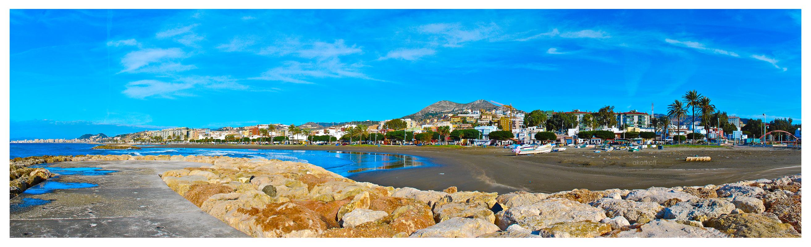 Classic Costa del Sol beach scene with blue sea and blue sky